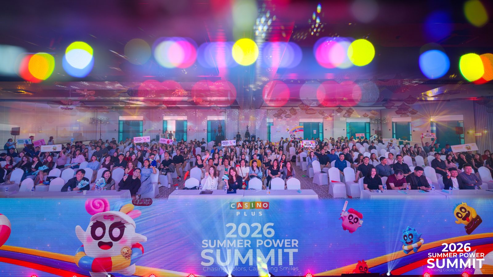 Audience in an auditorium with stage lighting