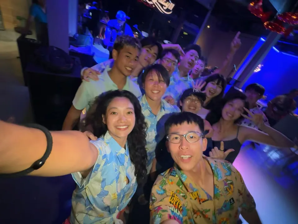 WaveUP team celebrating together at a night event