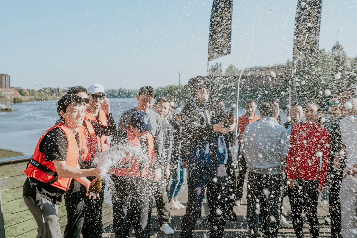 Team members taking part in an outdoor water challenge